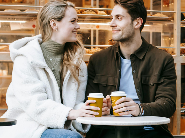 Couple discussing debt and finances on a coffee date