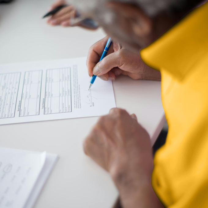 Man filling out a credit application after learning the difference between secured and unsecured debt
