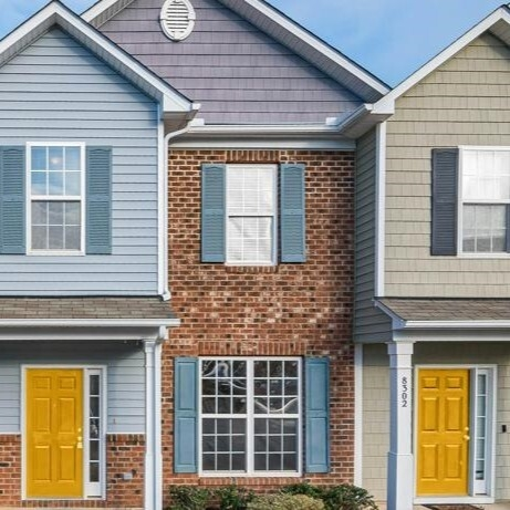 Two houses with yellow doors and mortgages up for renewal