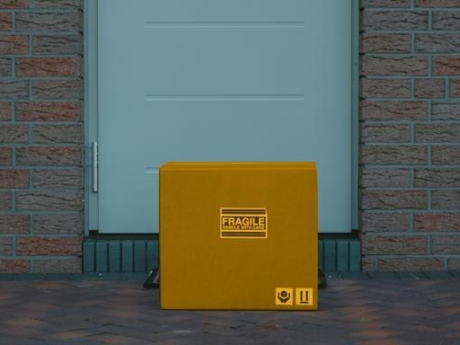 Yellow package lying on a doorstep after being purchased online using a buy now, pay later program