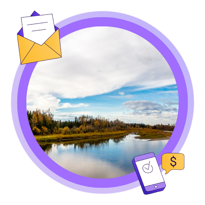 An image of a river in Red Deer during the Fall season, with a blue cloudy sky.